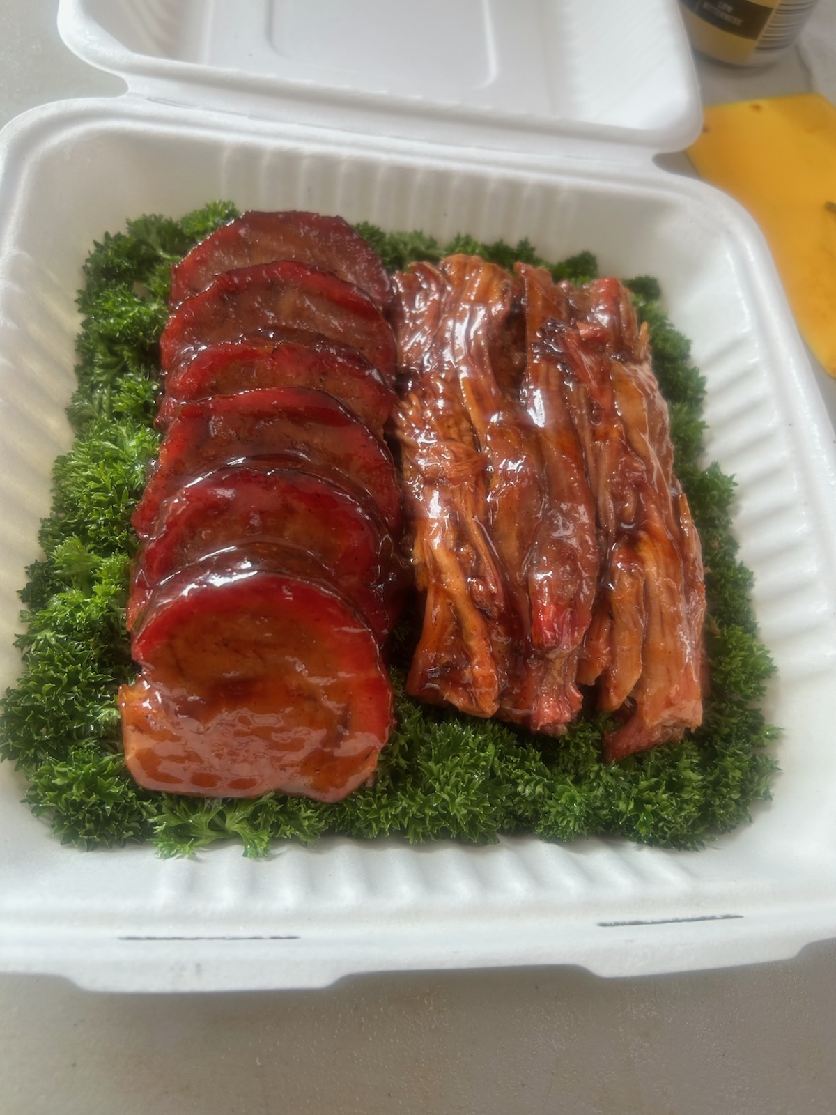 Sliced smoked meats served in a box