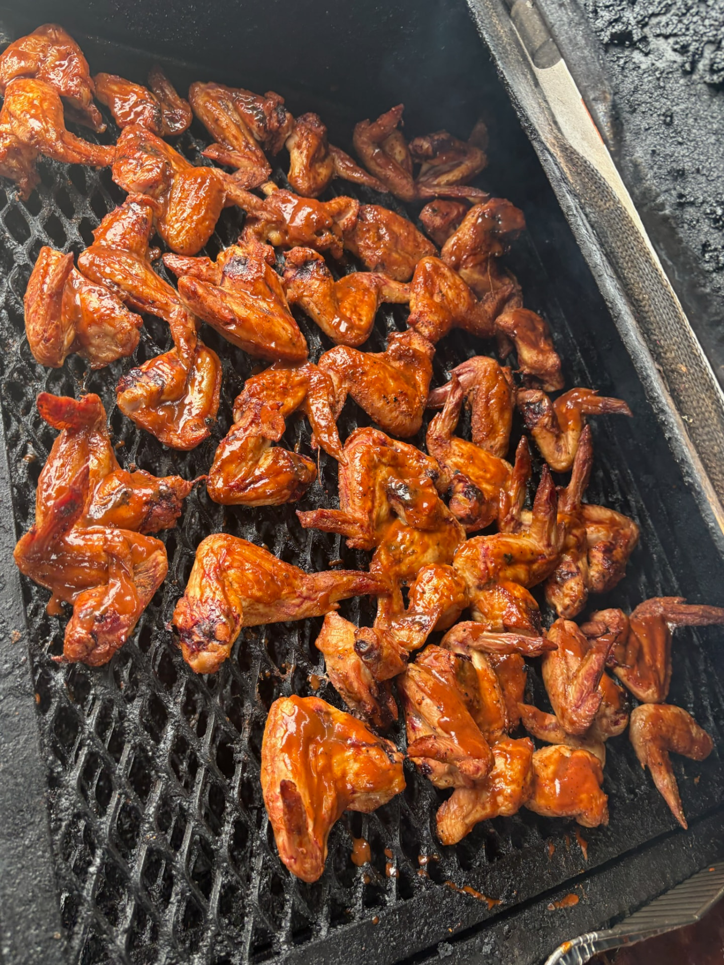 Glazed wings cooking on the smoker